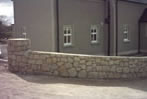 Brown Granite dry stone wall & pillars